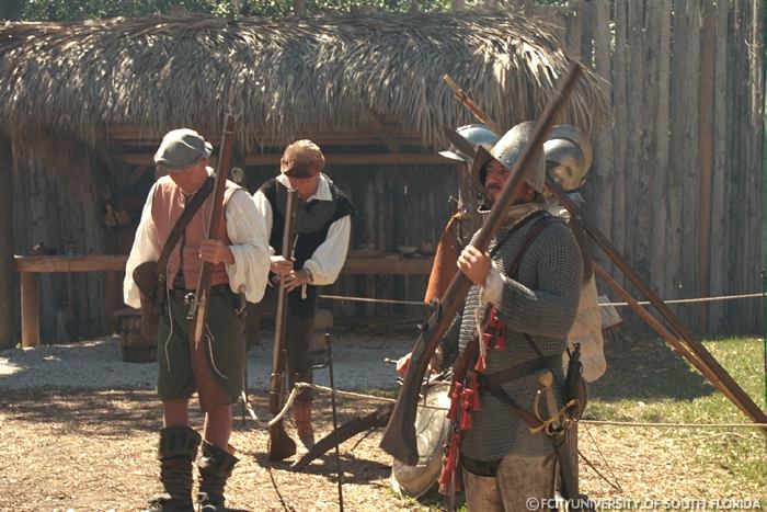 Reenactors carrying weapons