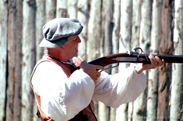 Conquistador displaying a musket